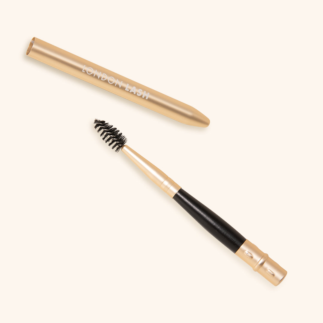 brush for eyelashes with protective metallic cap in gold colour