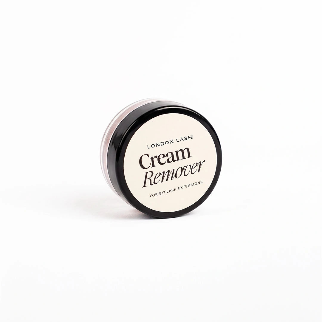 A small round jar of London Lash Cream Remover with a black lid and cream-colored label, photographed on a clean white background.