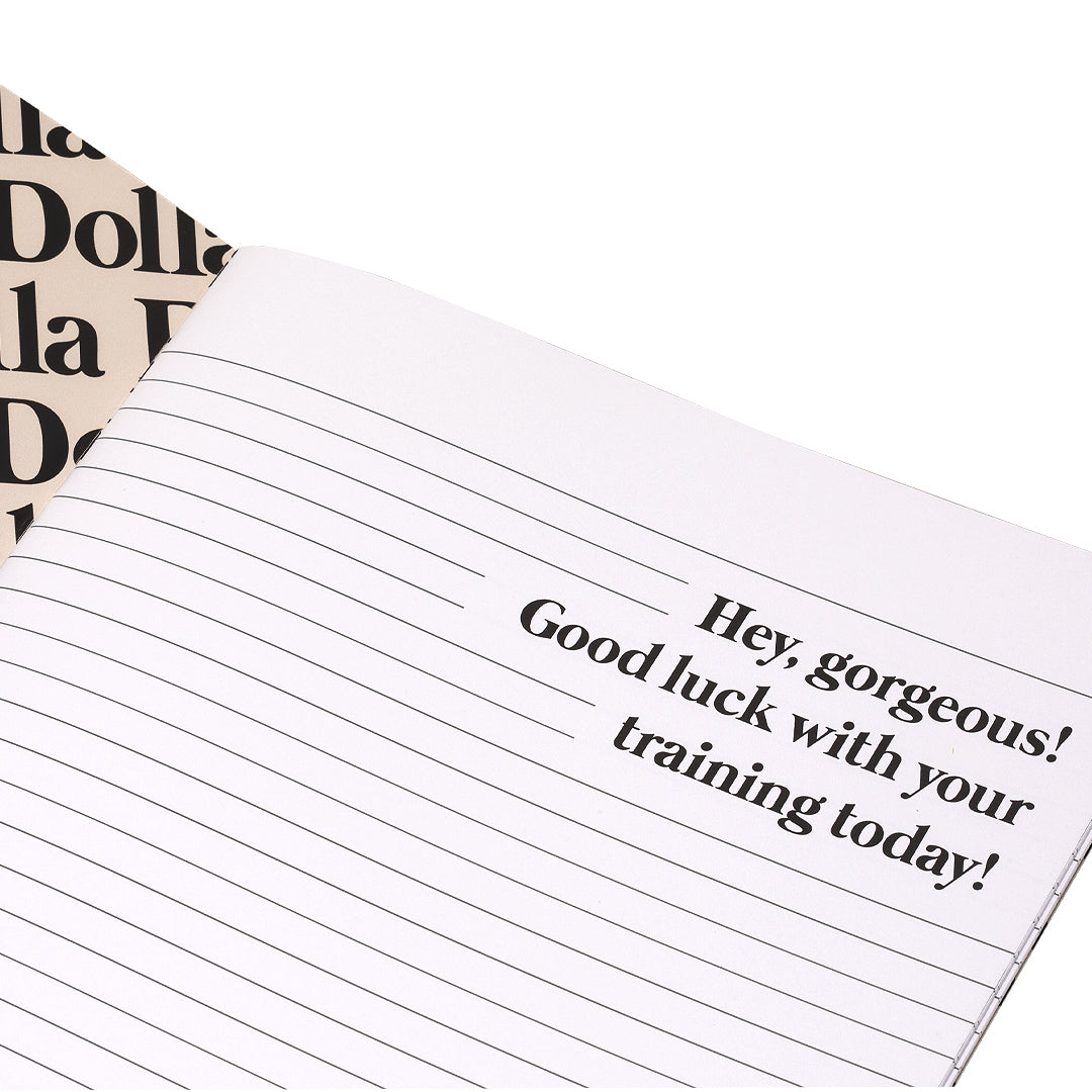 opened notebook and on the first page it has writing: Hey Gorgeous! Good luck with your training today