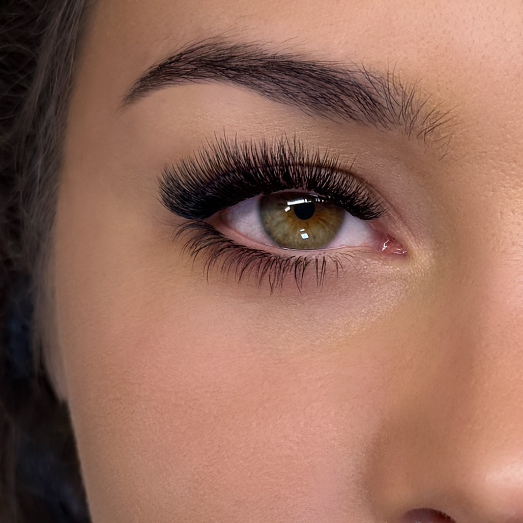 eye close up with bottom eyelash extensions work