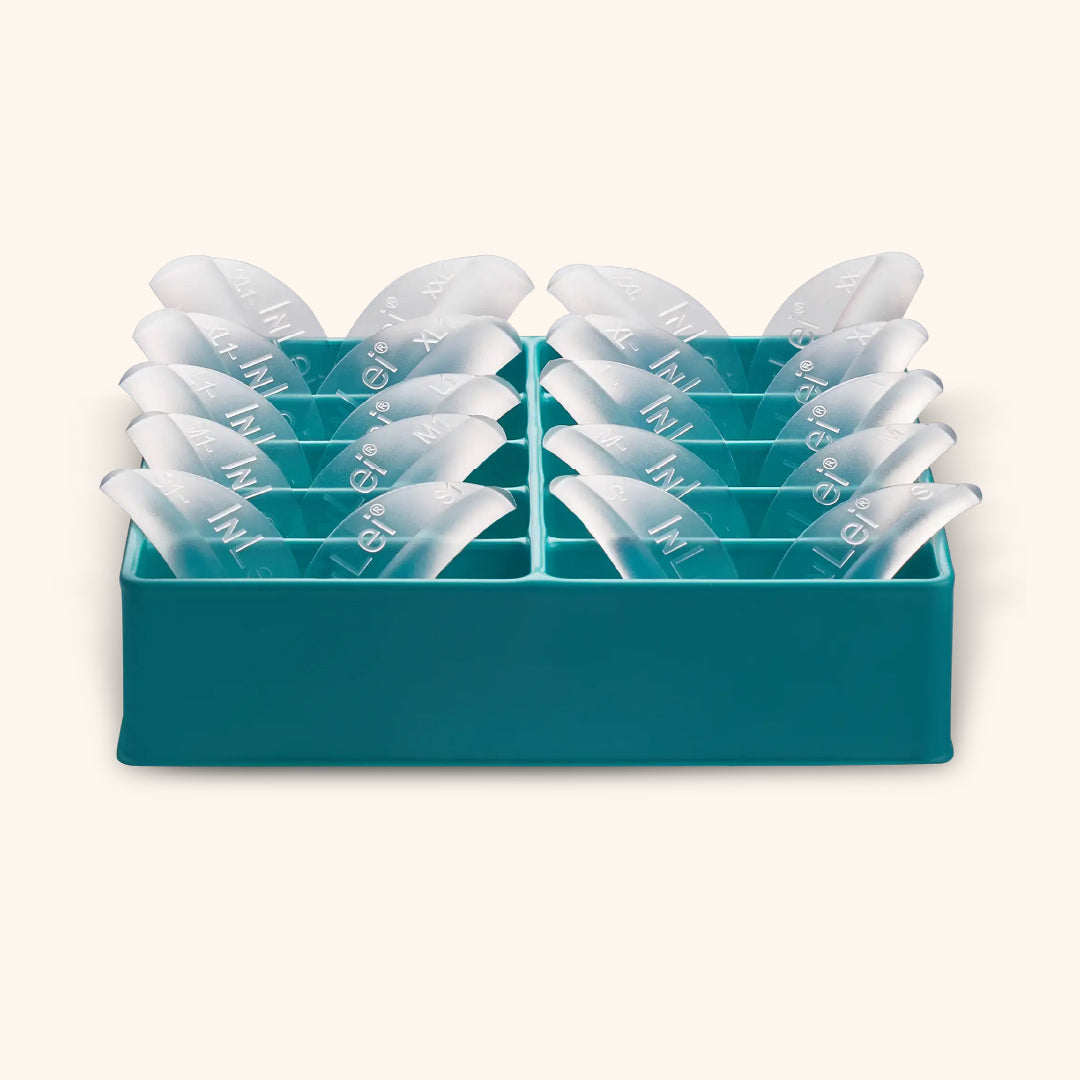 InLei TOTAL Silicone Lash Curlers set displayed in a teal holder, featuring multiple sizes for perfect lash lifts.