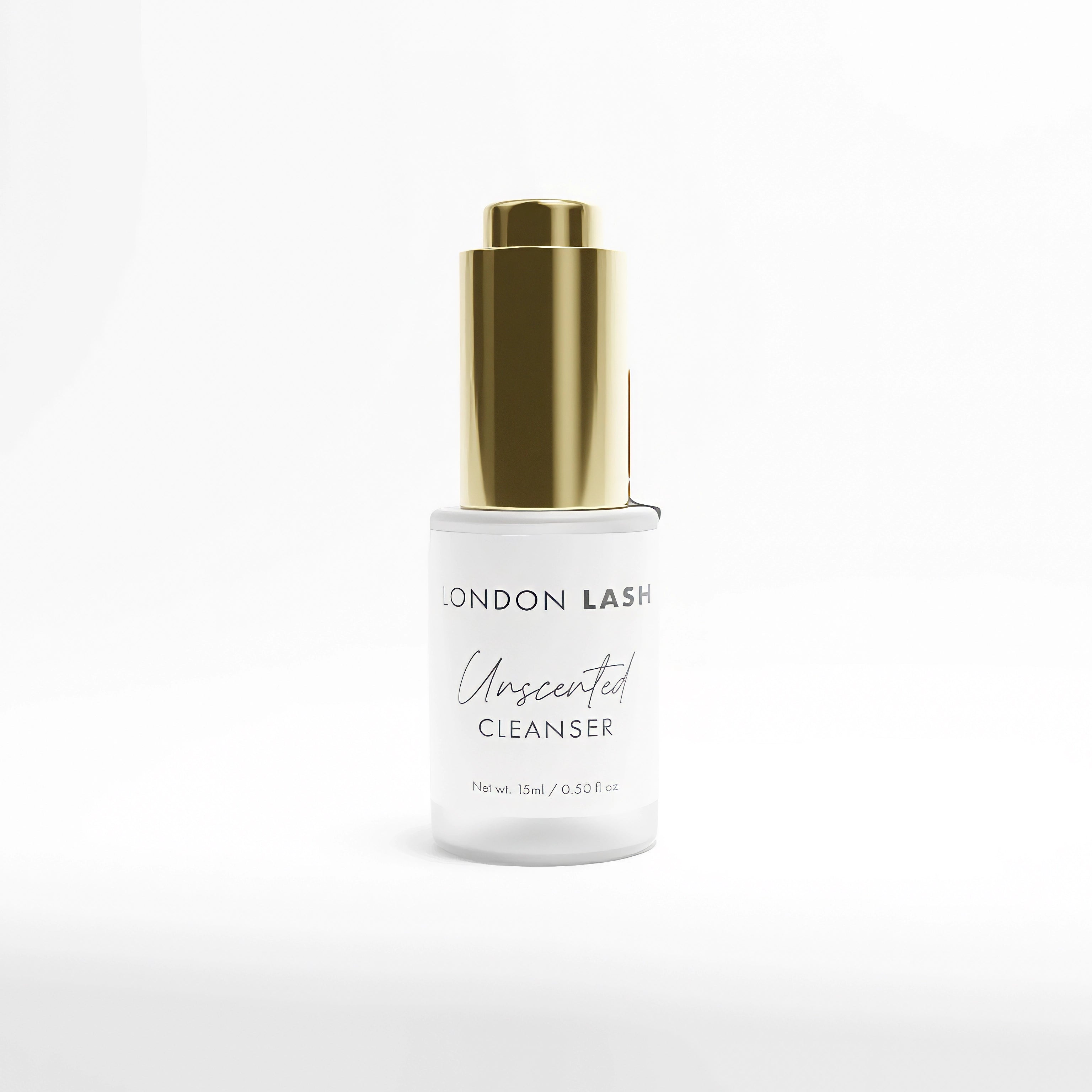 Eyelash cleanser bottle with gold cap on a white background