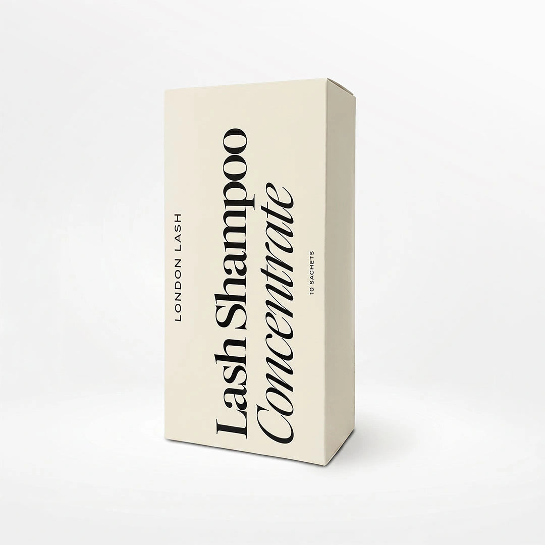 A cream-colored rectangular box for London Lash Lash Shampoo Concentrate, featuring black text on a clean white background.