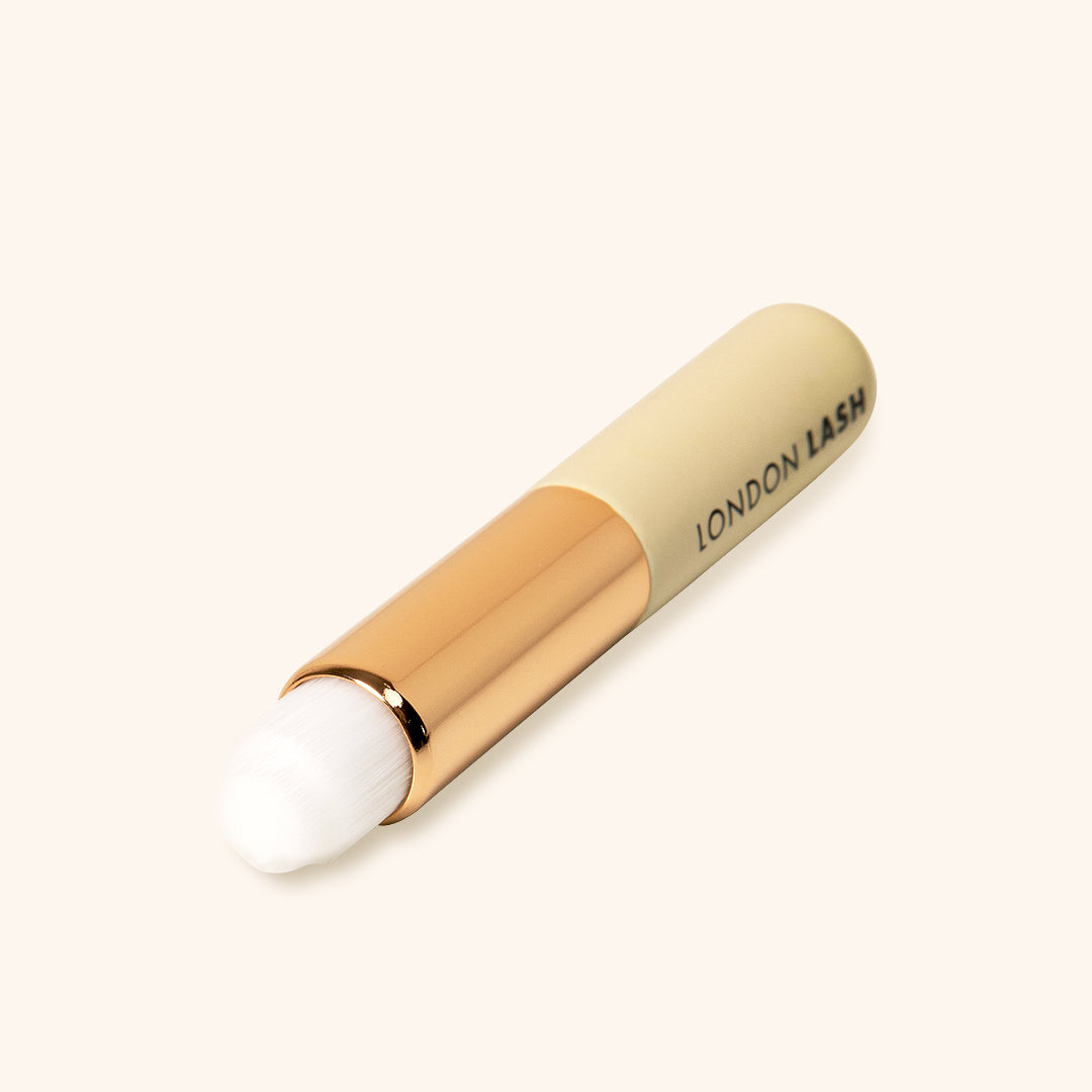 Beige in colour cleansin lash brush with embossed London Lash logo