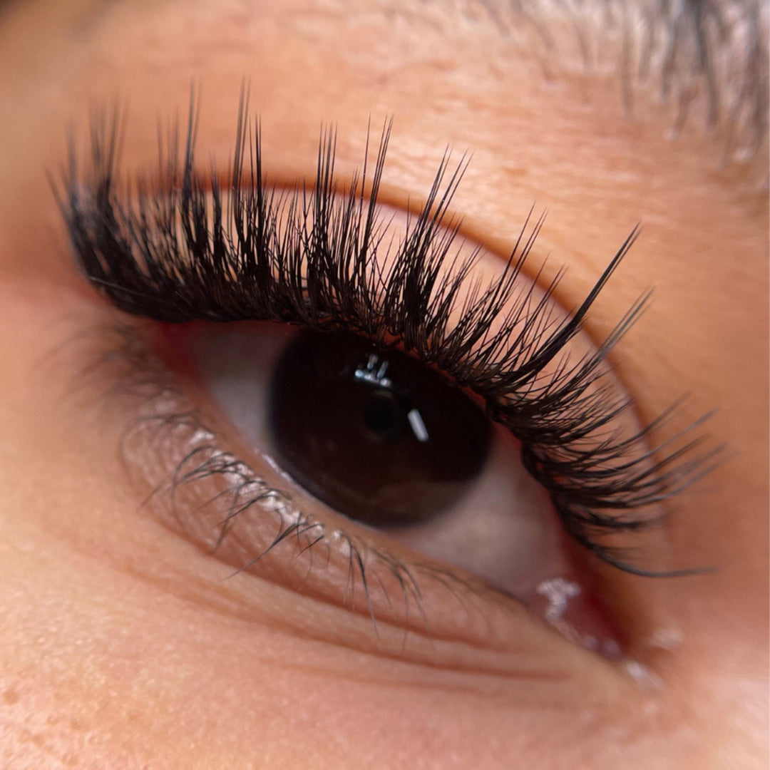 Eye close up wearing London Lash Kensington Lashes 0.085 showing defined satin finish eyelash extension result