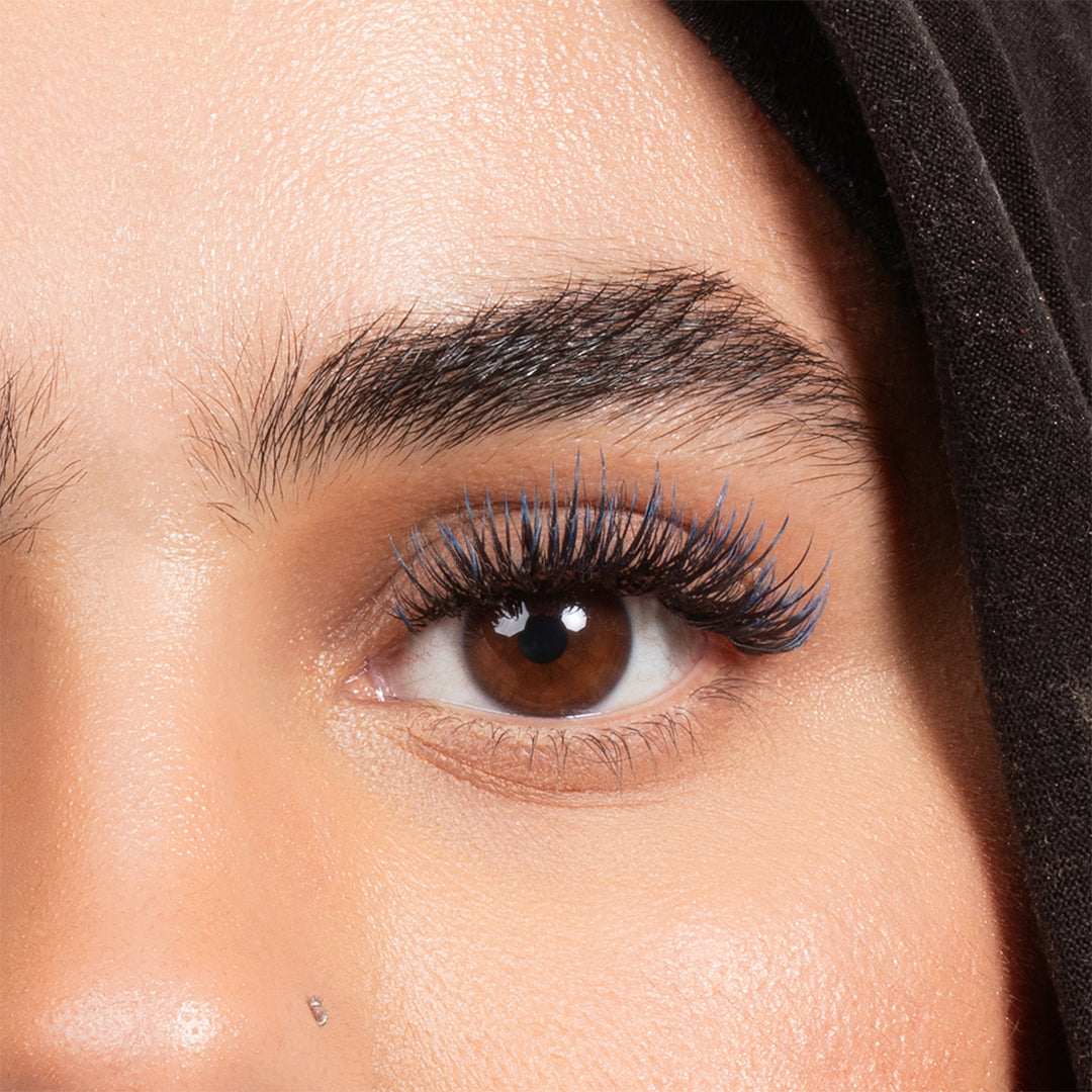 Close up of model wearing London Lash Blue Two-Tone Ombre eyelash extensions showing black to blue tip colour