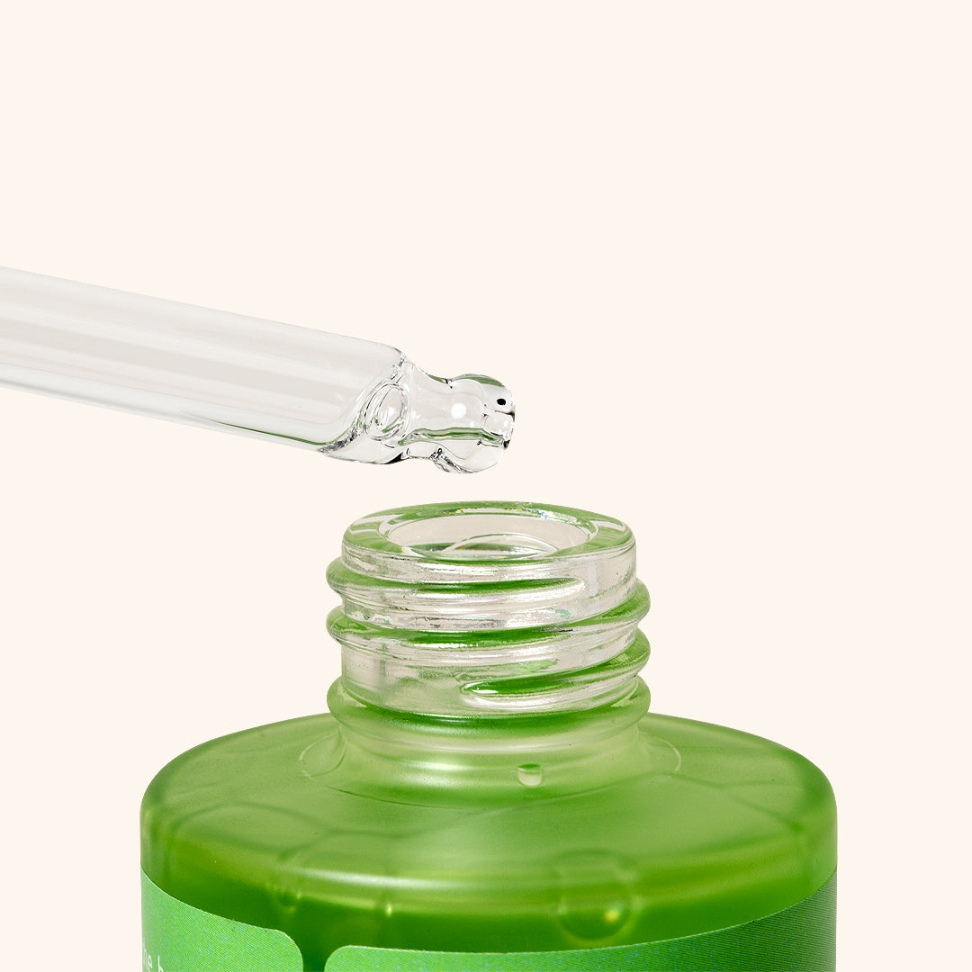 close up os the pipet taking water out of the bottle