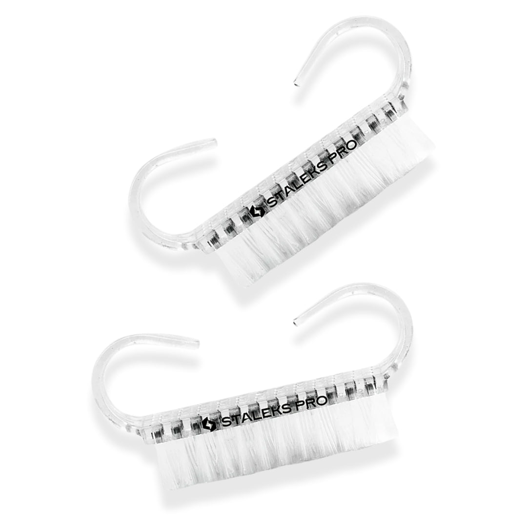two transparent plastic Staleks Manicure Brushes with handles on the white background