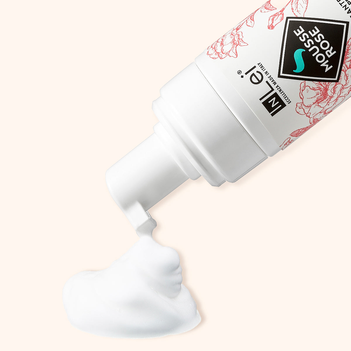 InLei Delicate Lash & Brow Shampoo - Rose foaming cleanser in a tube dispensing mousse on a light background.